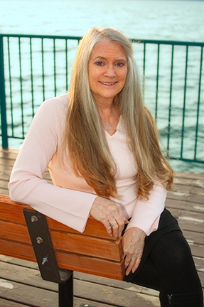 Photo of Carol Lehnert with Lake Tahoe in the background